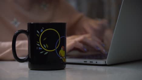 woman working on laptop at home