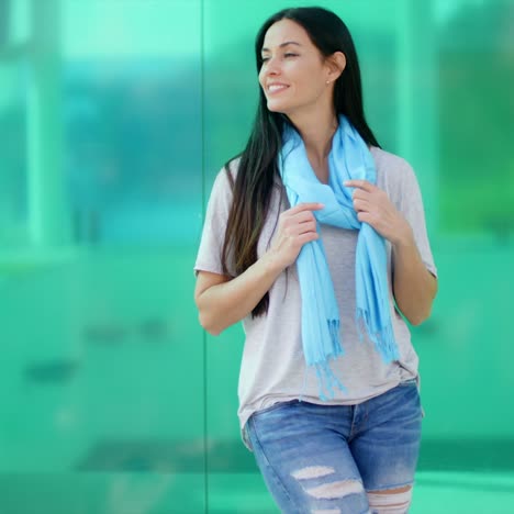 Happy-woman-looking-sideways-in-front-of-glass