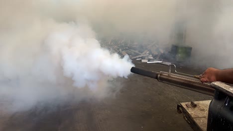 a fogging machine to kill the many mosquitoes is in operation