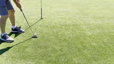 golfer putting on a sunny gold coast course