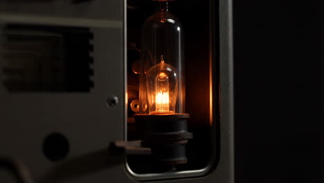 illuminated vintage vacuum tube in electronic device