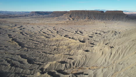 aerial view of barren lifeless land and desert landscape on hot sunny day, drone shot