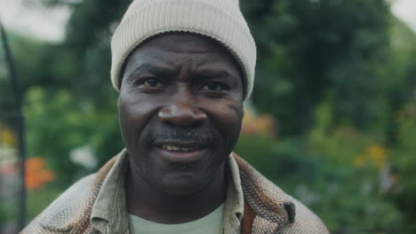 portrait of a smiling man in a garden