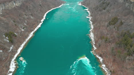 Aerial-shot-of-slow-moving-ice-cold-river