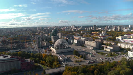 aerial view of a city center with a modern dome