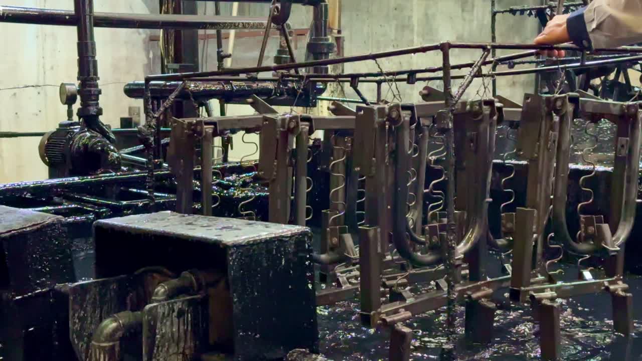 Electroplating process in industrial environment, close up view