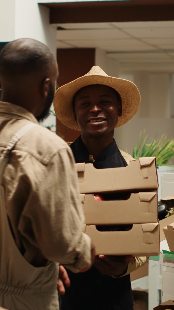 Vertical Video Small business owner receiving new produce stock from contractor