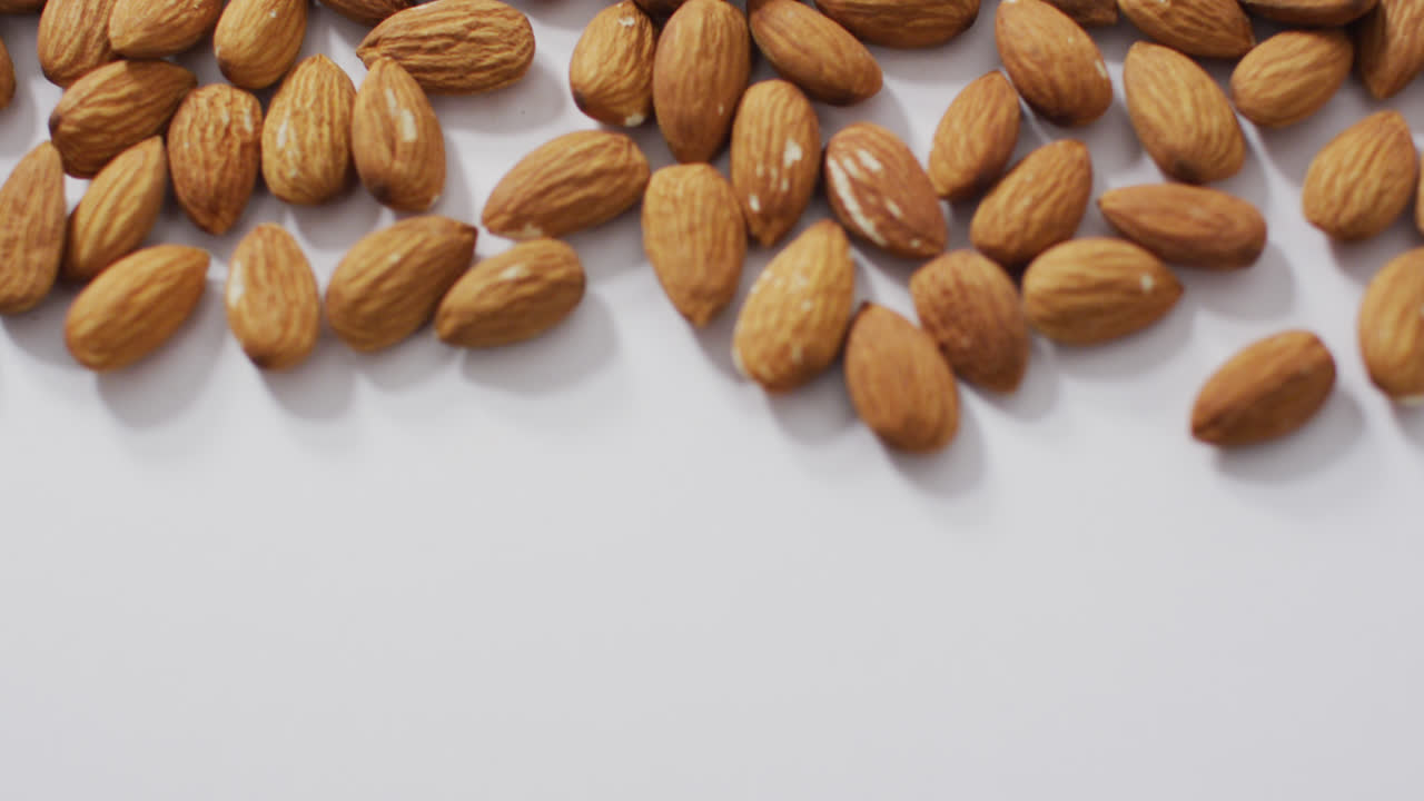 Video of almonds on white background