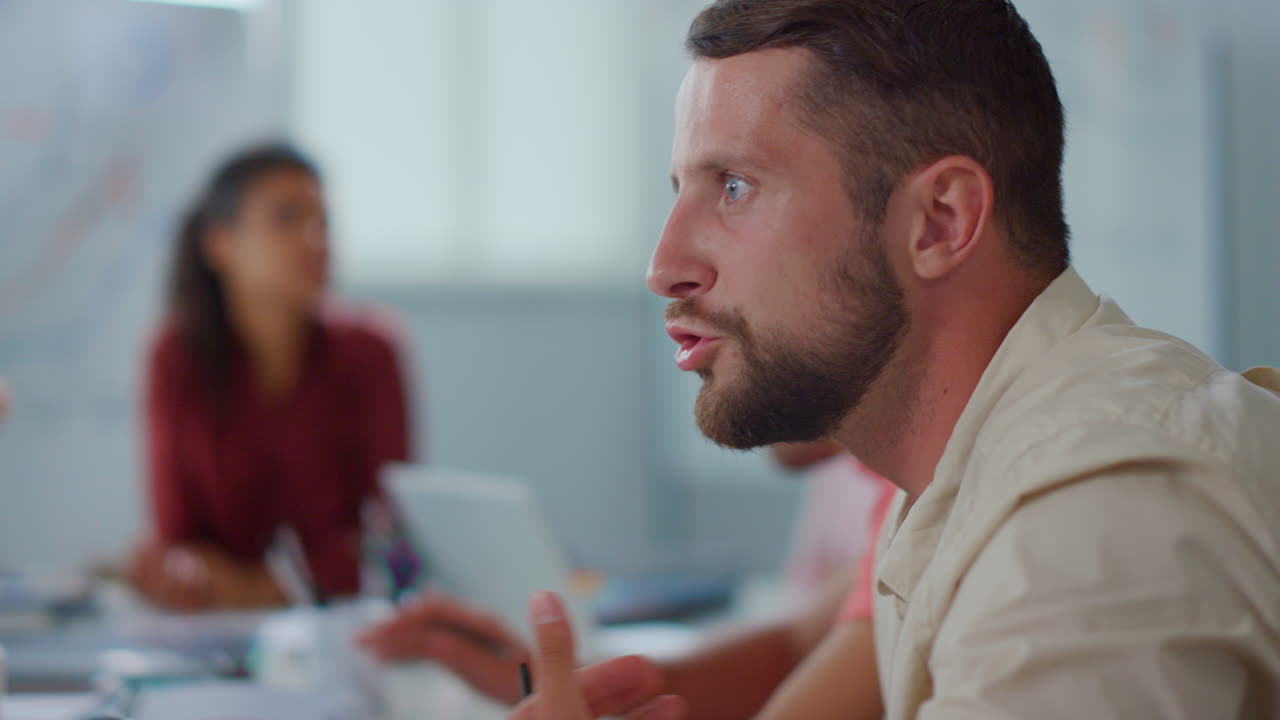 Closeup businessman discussing colleagues office. Rude man arguing partners