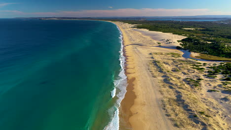 Revealing-drone-shot-of-coastline-at-Redhead-Beach