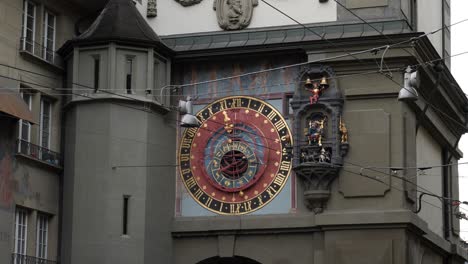 a static shot of the zytglogge clock in bern, with its moving figures striking the hour