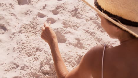 woman sitting on a sand