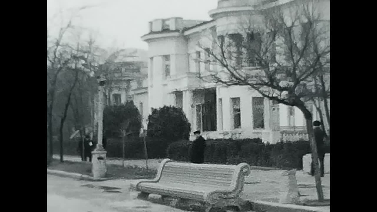 A Video of a Park Bench in Black and White. CIRCA USSR 1970: A timeless video showcasing a park bench in black and white, evoking nostalgia and simplicity.