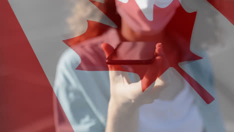 canadian flag waving against woman wearing face mask