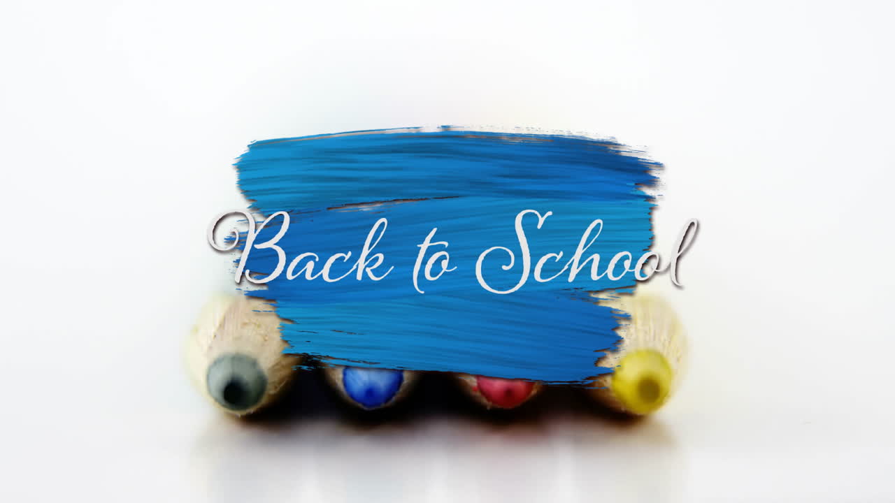 색 배경에 연필로 학교로 돌아가는 텍스트의 애니메이션