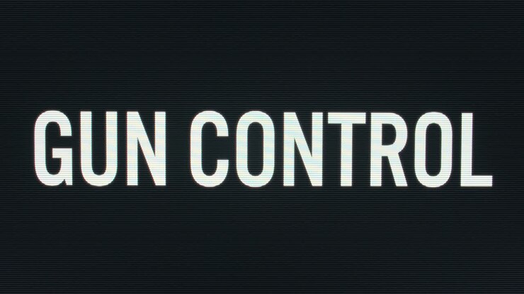 Closeup of Gun Control being Typed onto Vintage Computer Monitor with Blinking Cursor