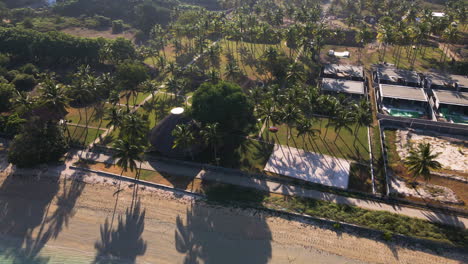 aerial view of a luxury beach resort with palm trees