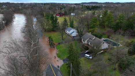 ascending drone shot of flooded river in american countryside after strong rain at night - lancaster, pennsylvania, america