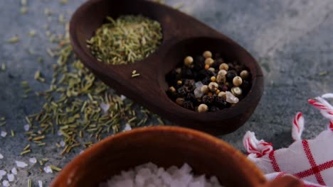 close-up of salt, speice, black pepper, garlic and herbs