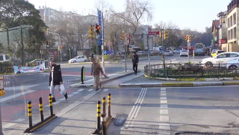 city intersection with pedestrians and traffic