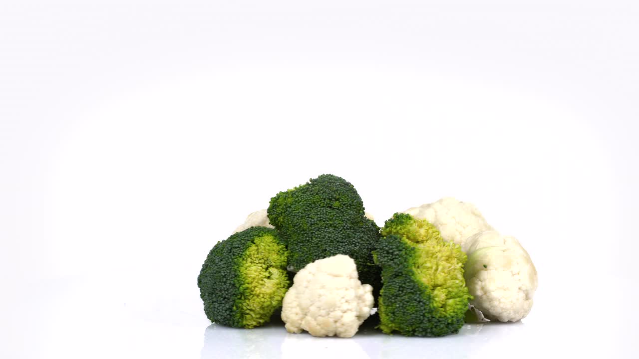 Endless Loop Of a Fresh Broccoli And CauliFlower Rotating On a White Background. Side View.