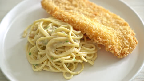 homemade spaghetti pasta white cream sauce with fried fish