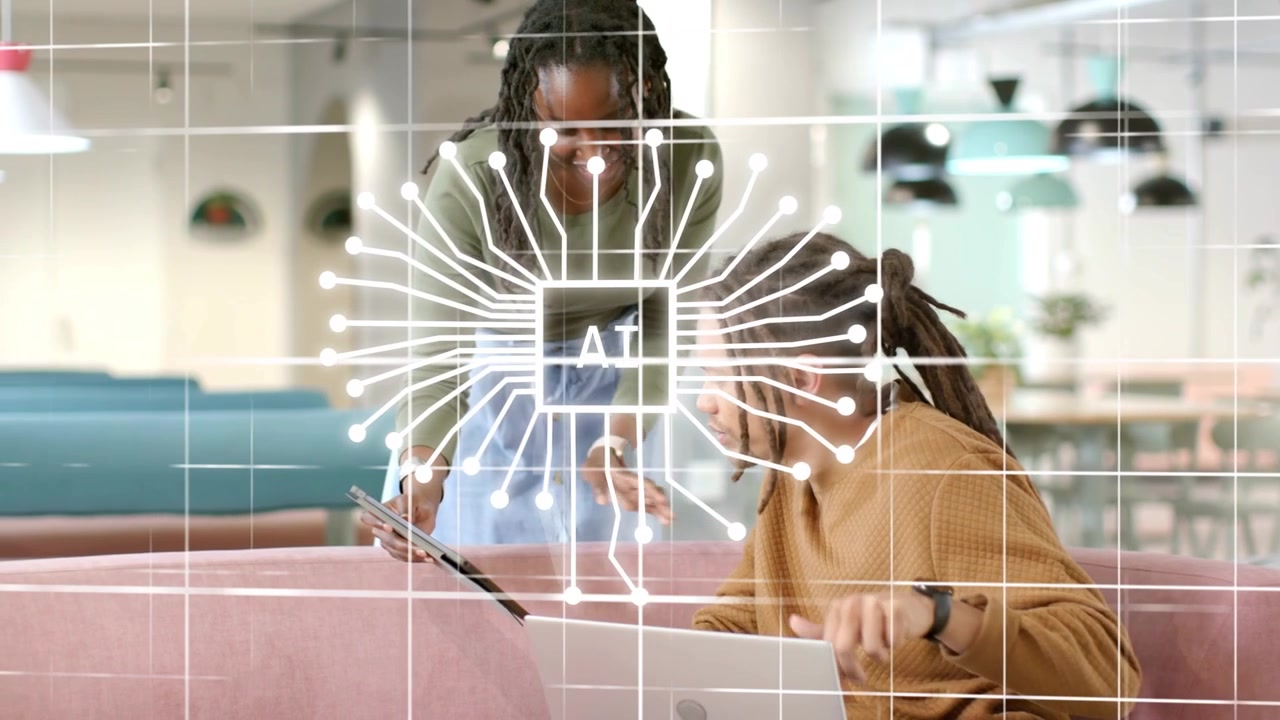 Standing woman showing tablet seated man reaching laptop grid forming AI overlaying desk for demo