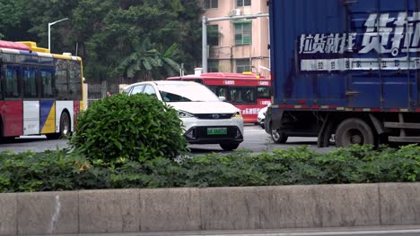 city intersection with buses and cars