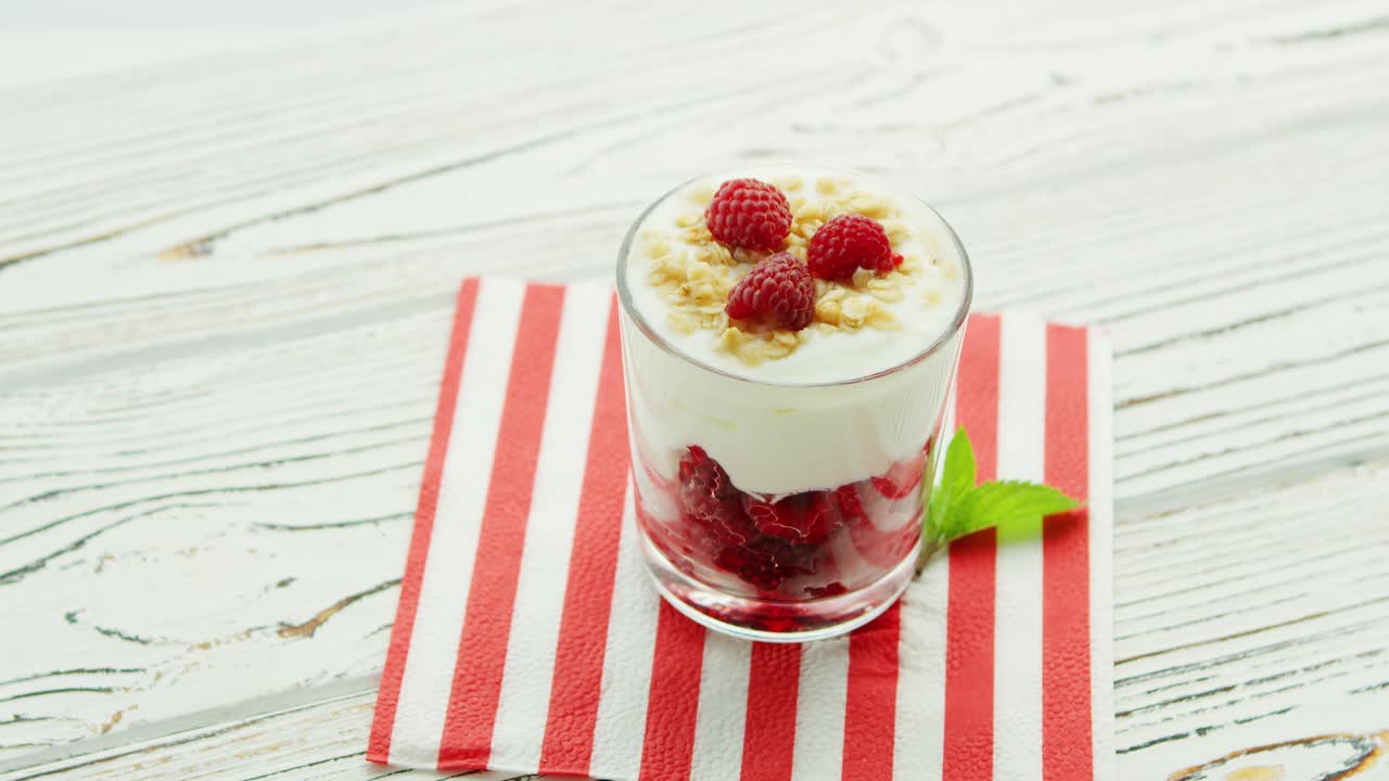 Glass with yogurt and raspberry