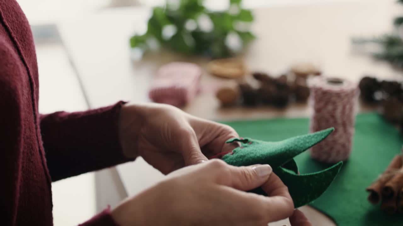 Close up of woman's hands preparing Christmas decoration