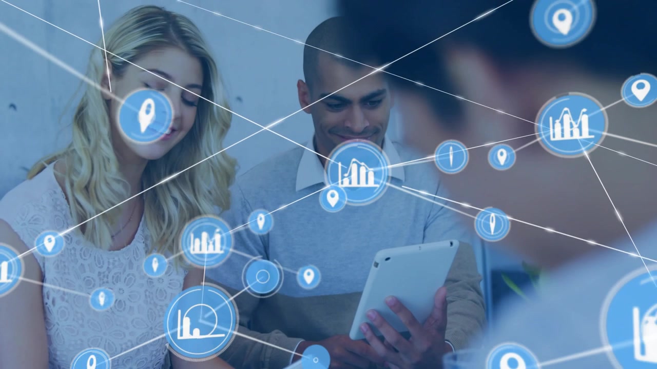 Woman leaning in while man tapping tablet, initiating data analytics icon overlay for collaboration