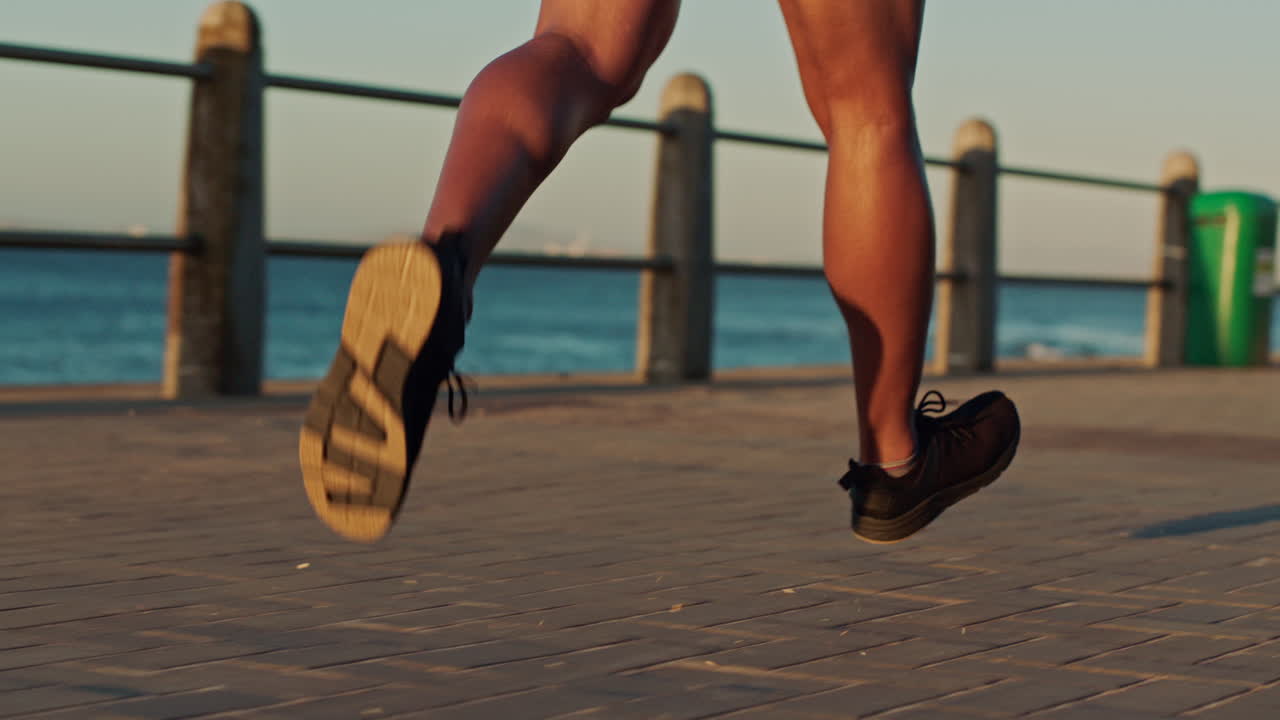 Fitness, beach and person running on promenade