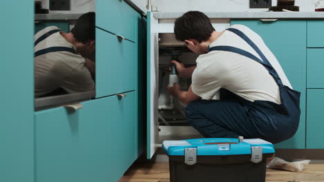 plumber fixing water pipes