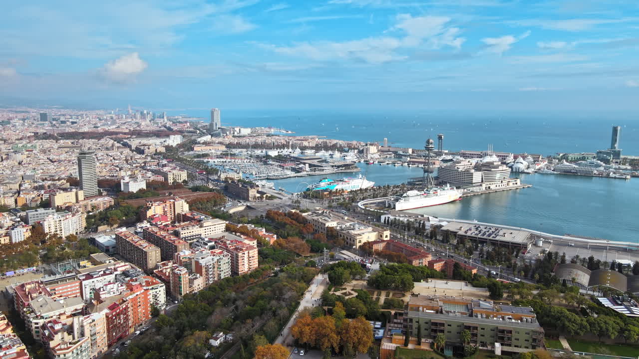 Aerial drone view of Barcelona city sea coastline with port. Sunny day. Montjuic district. Spain