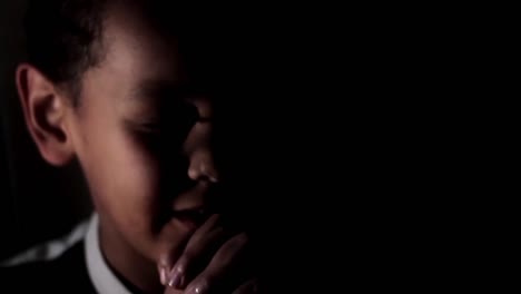 little boy praying to god with hands together stock footage-3