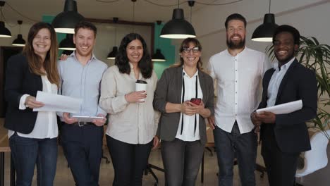 business team of multiracial people standing in front of camera during meeting work