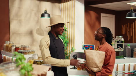 small business owner receiving new produce stock from contractor