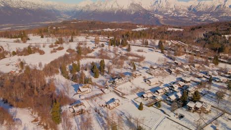 Tranquil-Village-Covered-With-Snow-During-Winter,-Dolomites-Mountains-At-Background-In-Trentino,-Italy