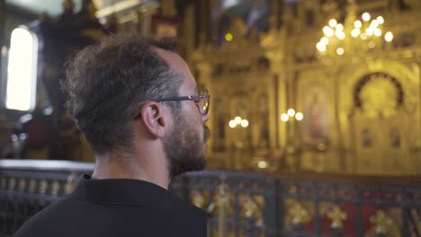 pensive man inside the church.