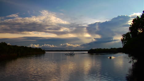 a motorboat passes quickly along the amazon river in brazil