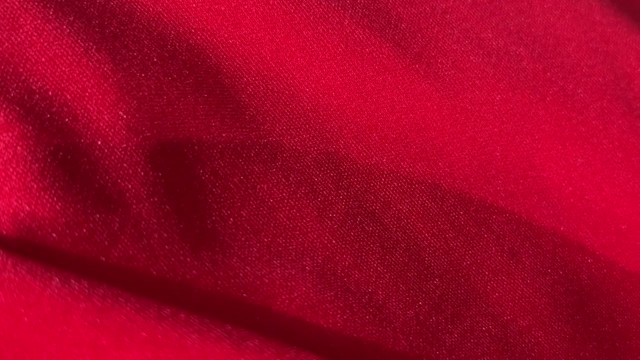 Close-up of Red Fabric Texture with Soft Folds