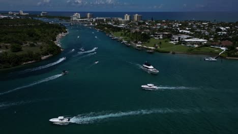 luxury boats from an aerial drone shot over the loxahatchee and indian river in florida on a beautiful day