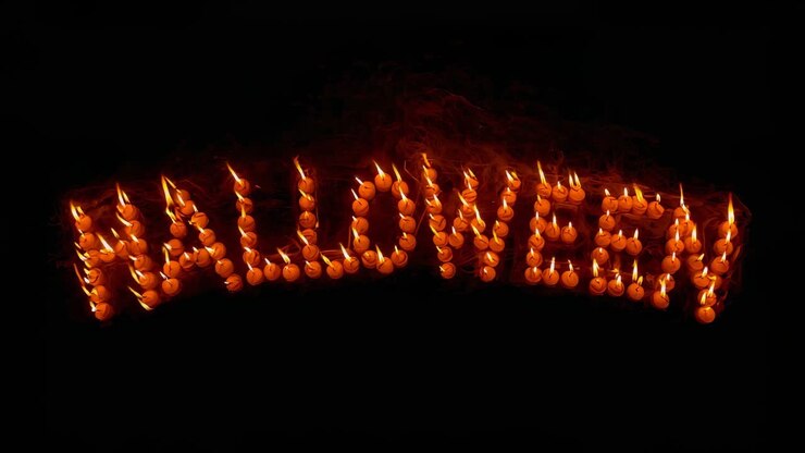 Opening arch of glowing pumpkins spelling HALLOWEEN! flickering in dark void with pulsing flames