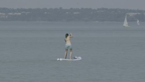 a young girl goes over on the lake balaton