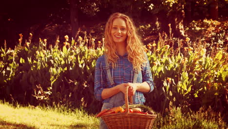 happy pretty woman holding basket with carrot