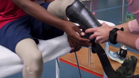 man exercising with prosthetic legs