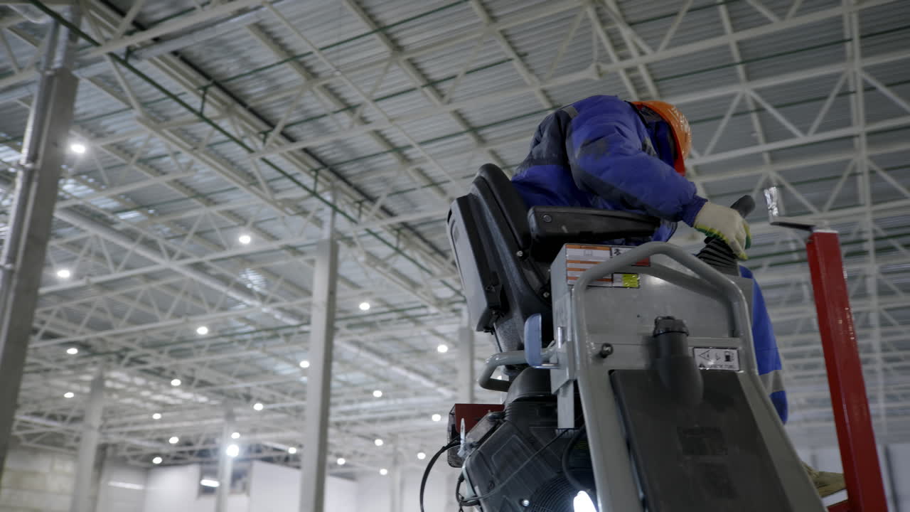 Industrial Worker Operating Floor Polishing Equipment