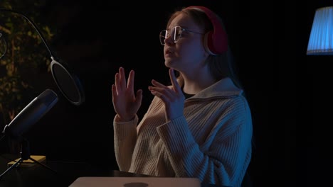 woman recording podcast or video