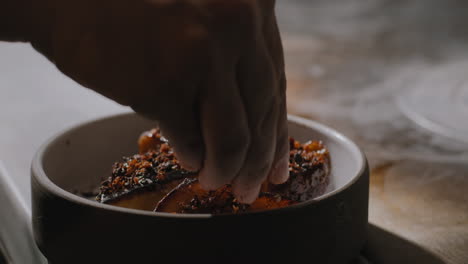 Garnishing-a-plate-of-sauteed-sweet-potatoes