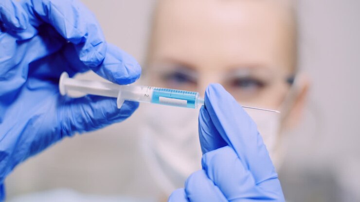 Doctor Holding Syringe In Hands 1